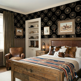 Frontier Wheelhouse wallpaper featuring a decorative wagon wheel pattern against a dark backdrop.
