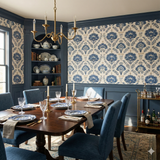 Indigo wallpaper from Linenfolk with a blue floral damask pattern over an off-white linen texture.