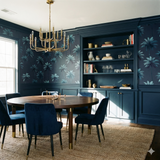 Navy blue Palm Nocturne Wallpaper with tropical palm tree pattern, seen in a styled dining room.