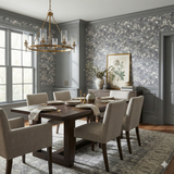 Floral pattern Wintering Vale Wallpaper with gray background, textured finish, and wall trim in a dining room setting.