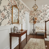 Floral Ink Bloom Camellia Wallpaper with pink flowers and dark stems, patterned wallpaper.

