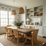 Seagull pattern Saltwind Wallpaper from Seabrook Wallcoverings, visible on the upper wall of a dining room with natural decor.
