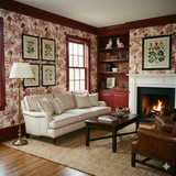 Red and white toile wallpaper with floral botanical artwork on display, in a traditional room.