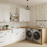 Olive Lineage Wallpaper featuring a green leaf pattern on a neutral background.
