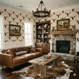 Patterned Redrock Signal Wallpaper with bull skull print, decorating a living room with furniture and a fireplace.