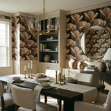 Floral study wallpaper with magnolia bloom pattern, against a neutral dining room setup.
