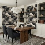 Cumulus Companion Wallpaper with a black and white dog pattern, covering the walls of a dining room setting.
