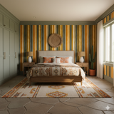 Mesa Strata wallpaper with vertical striped pattern on the wall, shown in an interior bedroom setting.