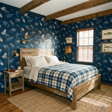 Angler’s keepsake flies wallpaper with blue and white pattern, showing fishing rods, next to a wooden bed frame.
