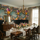 Elysian Montage Wallpaper with florals and mountain landscape details, displayed on the wall of a dining room.