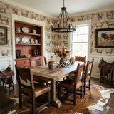 Cattle etchings wallpaper with cow pattern, decorating a dining room with rustic furniture and accessories.

