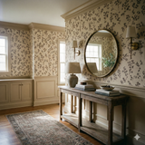 Floral pattern Stillfield Wallpaper with a beige background, covering the walls of an entryway, complemented by traditional furniture.