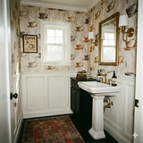 Coffee-themed Hearthside Steam Wallpaper with cup and saucer print, decorating a bathroom interior.
