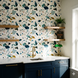 Patterned wallpaper by Wallshoppe, featuring a colorful terrazzo-inspired design with blue, teal, gold, and gray shapes.
