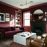 Bordeaux Thicket wallpaper with floral pattern on a dark red background.