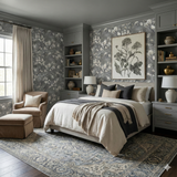 Gray floral wallpaper with botanical art, styled in bedroom setting.