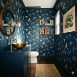 Angler's Keepsake Flies wallpaper featuring a repeating pattern of fishing lures and feathers, with built-in shelves and a framed print of fish.

