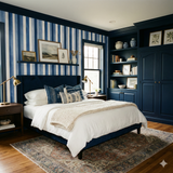 Striped blue and white wallpaper with vertical stripes, with a shelf holding picture frames.