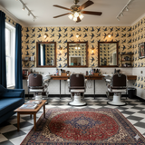 Yellow wallpaper with blue bird pattern, from Wallpaper Direct, in a barber shop interior.
