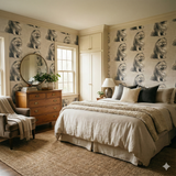 Wintertail Wallpaper with a dog pattern print covering a bedroom wall.
