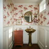 Bridle Rue wallpaper featuring a pink hat pattern on a light cream background.
