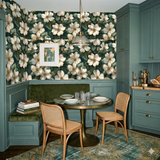 Verdant Camellia Reverie Wallpaper with floral pattern and dark green background.
