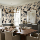 Neutral wallpaper with crane and palm pattern, Shadowmere Palms Wallpaper, in a dining room setting.
