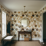 Mocha rings wallpaper with brown and beige circles pattern covering the wall.
