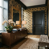 Imperial script wallpaper with a gold and black pattern featuring floral details.