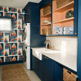 Regatta Minor Wallpaper with boat pattern against a blue and cream background.