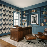 Patterned wallpaper with dog motifs, repeated on the wall, in a traditionally styled office setting.