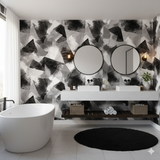 Obsidian Shard Wallpaper with black and white brushstroke pattern, abstract geometric shapes, visible in a modern bathroom setting.
