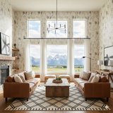 Line herd wallpaper featuring animal pattern on the walls of a living room.
