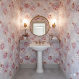 Sakura Lantern Bloom wallpaper with floral pattern on the walls in a small powder room.