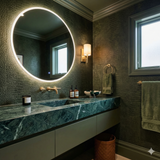 Verde Sauvage Wallpaper with crocodile pattern texture, covering the bathroom wall behind a green marble countertop.