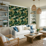 Monstera leaf wallpaper with green and brown tones, covering a wall between built-in shelves.

