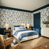 Bluewind Meadow wallpaper with blue floral pattern over a light beige background, styled in a traditional bedroom.