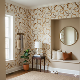 Terra Interlock Wallpaper with neutral and brown interlocking circle pattern, styled in an entryway.