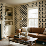Black and white nail wallpaper pattern by Iron Range Mark, visible in a staged living room setting.
