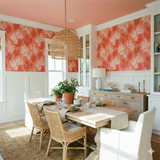 Coraline Shoals wallpaper with a coral and white botanical print pattern.