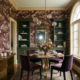 Patterned tapestry wallpaper with floral and mountain details, set in a dining room.
