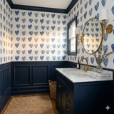 Blue Valentine Ledger wallpaper with heart pattern, and navy blue wainscoting and trim.