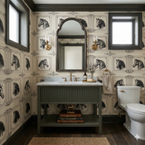 Horse-themed Chevalet Classique Wallpaper with equine patterns, framed on a beige backdrop, adorns this powder room wall.
