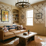 Prairie Reliquary Wallpaper featuring a pattern of steer skulls in a Western-themed interior.
