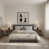 Ink scatter wallpaper with abstract pattern, visible on a bedroom accent wall.