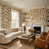 Savanna Ink wallpaper with a beige animal print by York Wallcoverings, decorating a living room with natural light and neutral furniture.
