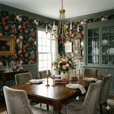 Vineland Tableau wallpaper with dark floral pattern, filling a traditionally styled dining room.
