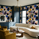 Colorful geometric pattern wallpaper with floral accents on textured wall.