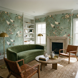 Kyoto Crane Wallpaper with a light blue crane and floral pattern, covering an entire living room wall.