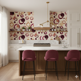 Bordeaux Echo Wallpaper featuring circle patterns in warm tones, covering two walls in a kitchen setting.